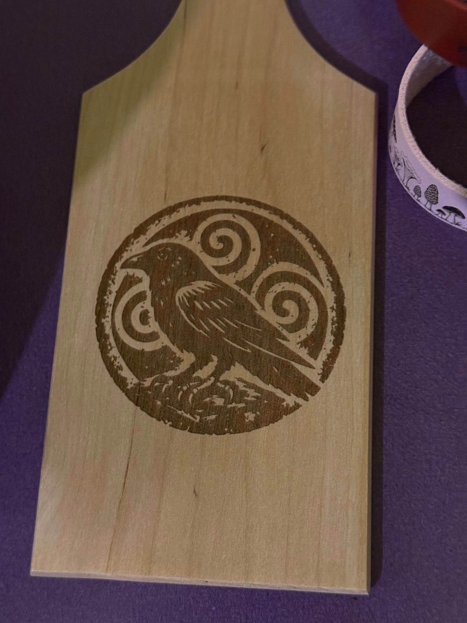 Wood-burned Celtic raven and triskelion paddle board by Loren Morris, Primitive Witchery