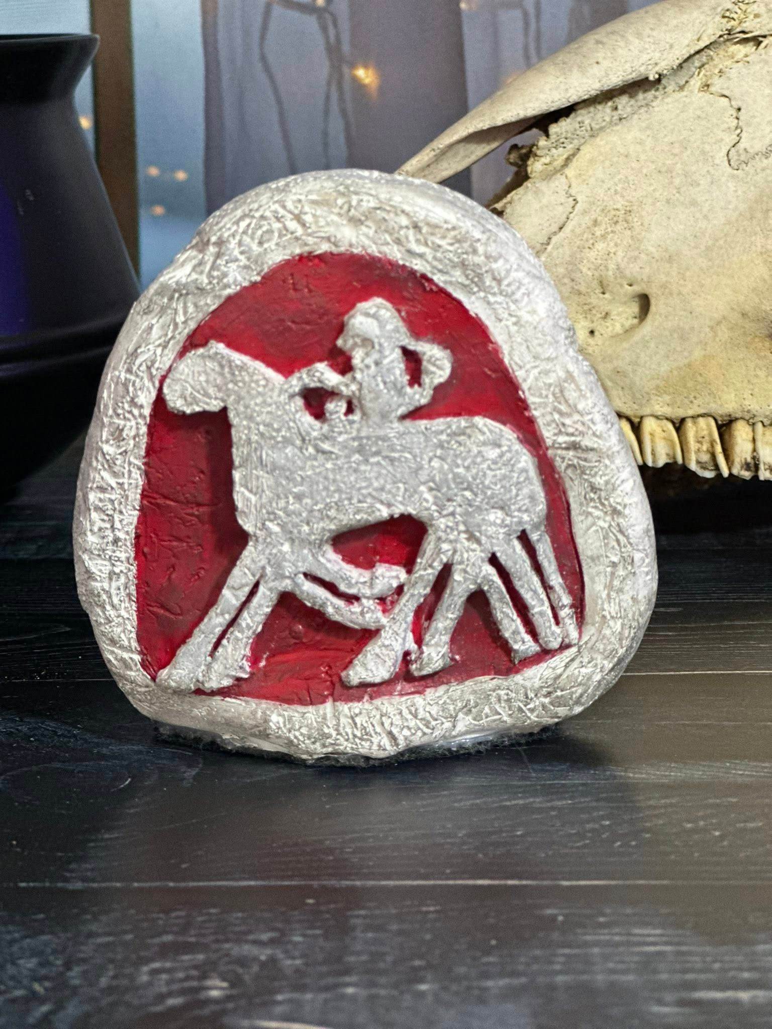Sculpted Odin stone with silver figure on red background by Loren Morris, Primitive Witchery