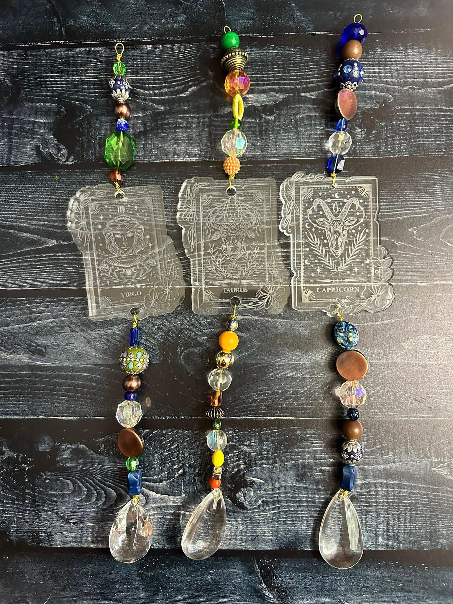 Etched acrylic zodiac suncatchers with crystal drops by Loren Morris, Primitive Witchery